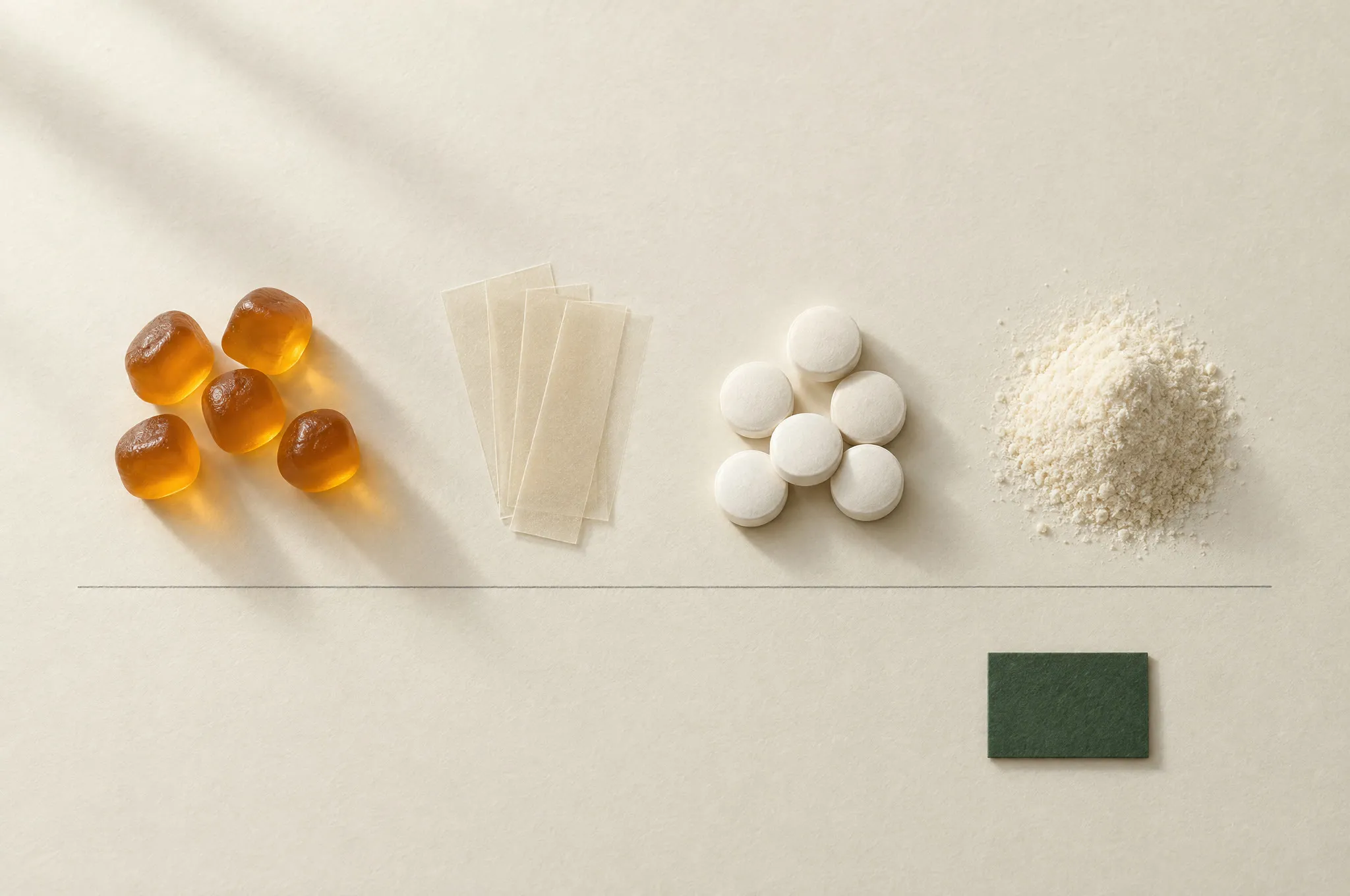 Gummies, oral film strips, tablets and powder in a row on paper